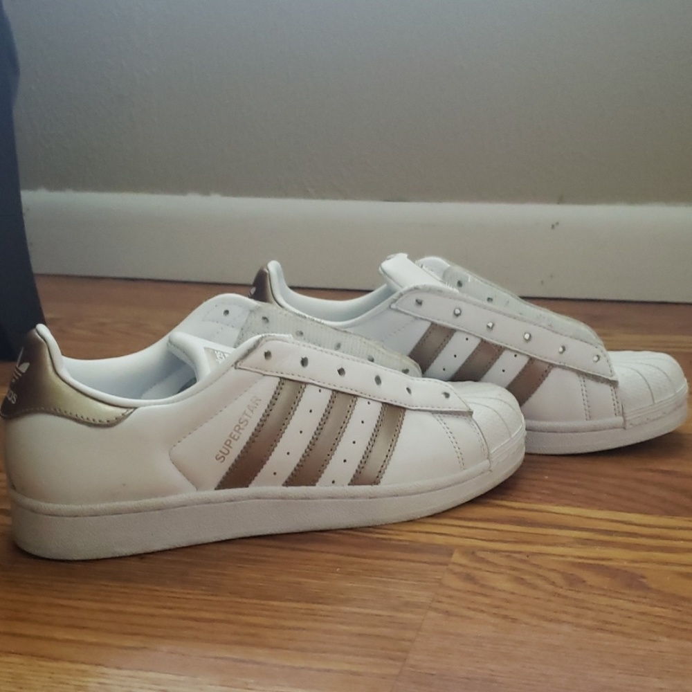 Adidas superstars with gold detail